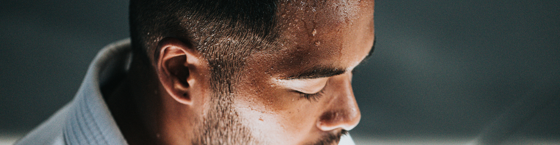 close up of a man's sweating forehead