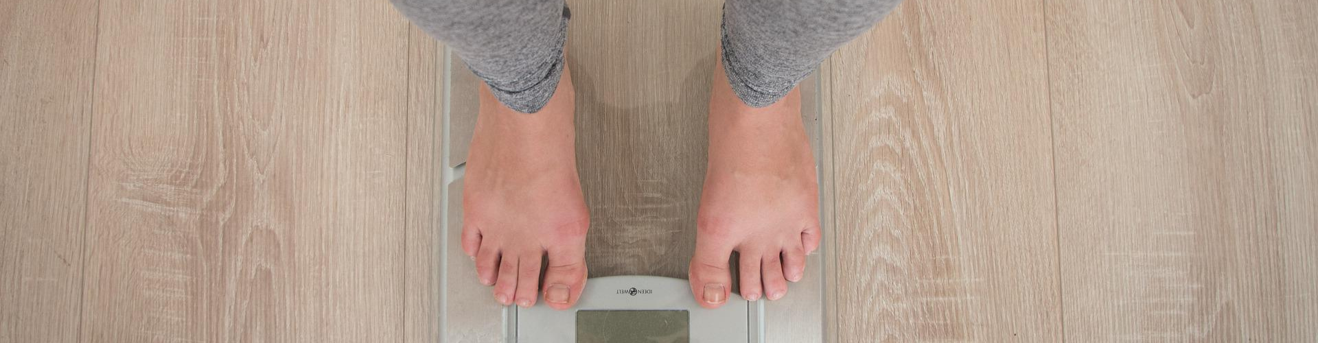 feet standing on a scale